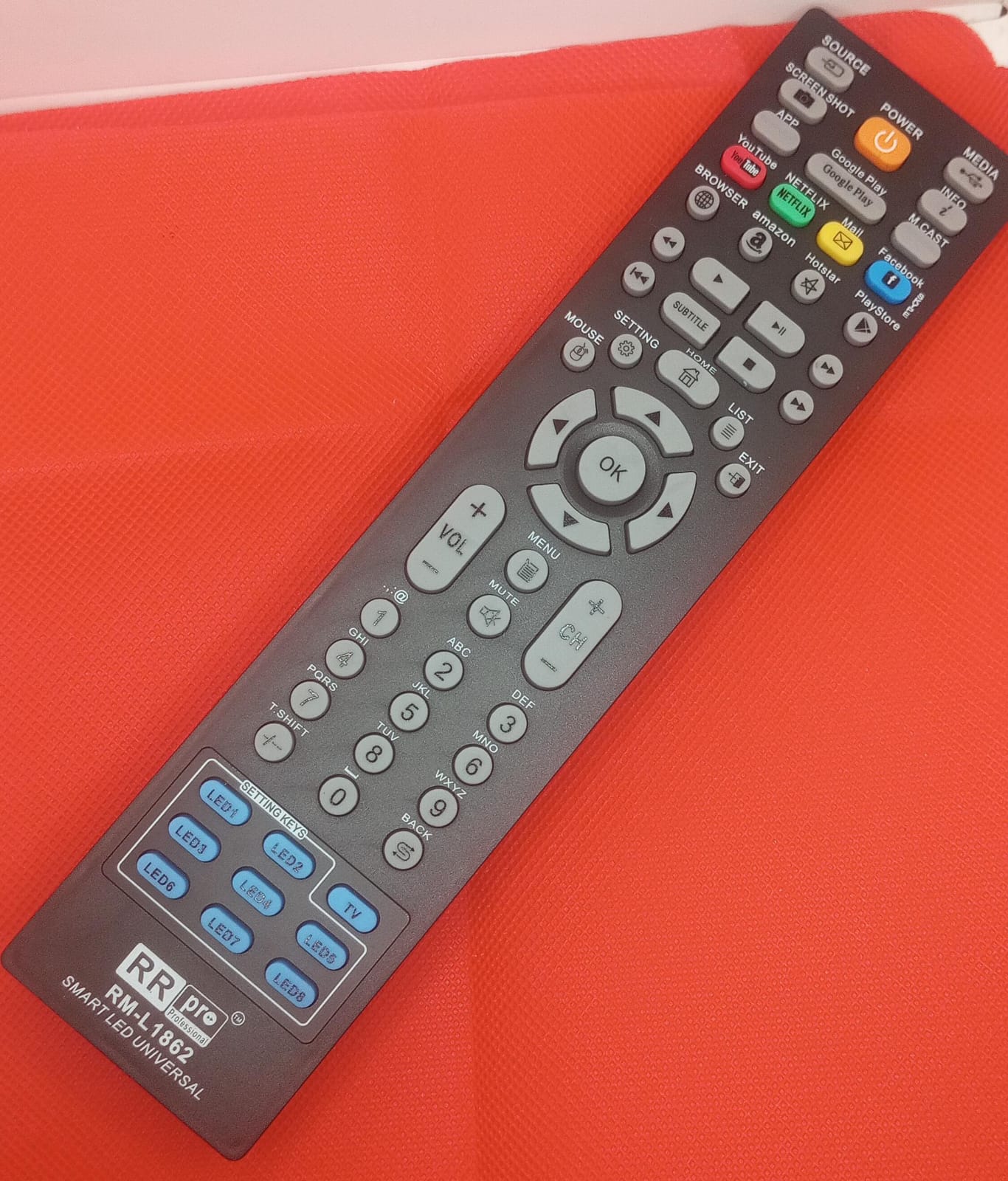 Universal remote control with ergonomic design and broad compatibility for various TV types.